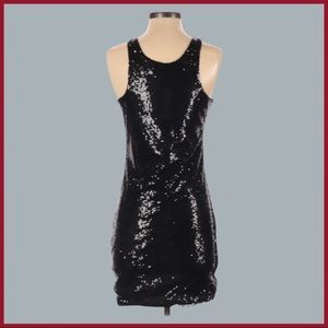BLQ.MKT Fantastic holiday and party mini dress in black sequins. Fully lined.